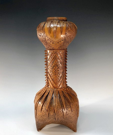 ceramic vase sculpture with leather like surface treatment